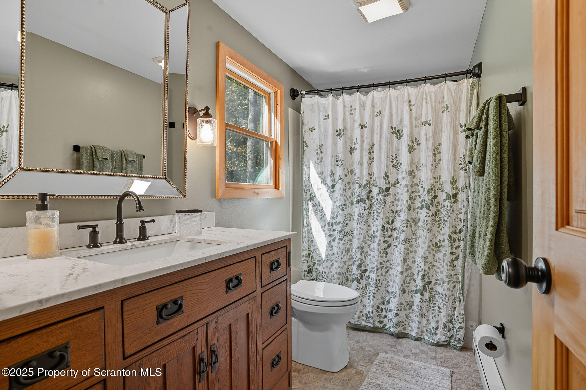 452 Engvaldsen Road Hawley, PA 18428 - Photo 25 of 42 a bathroom with a granite countertop sink toilet and shower