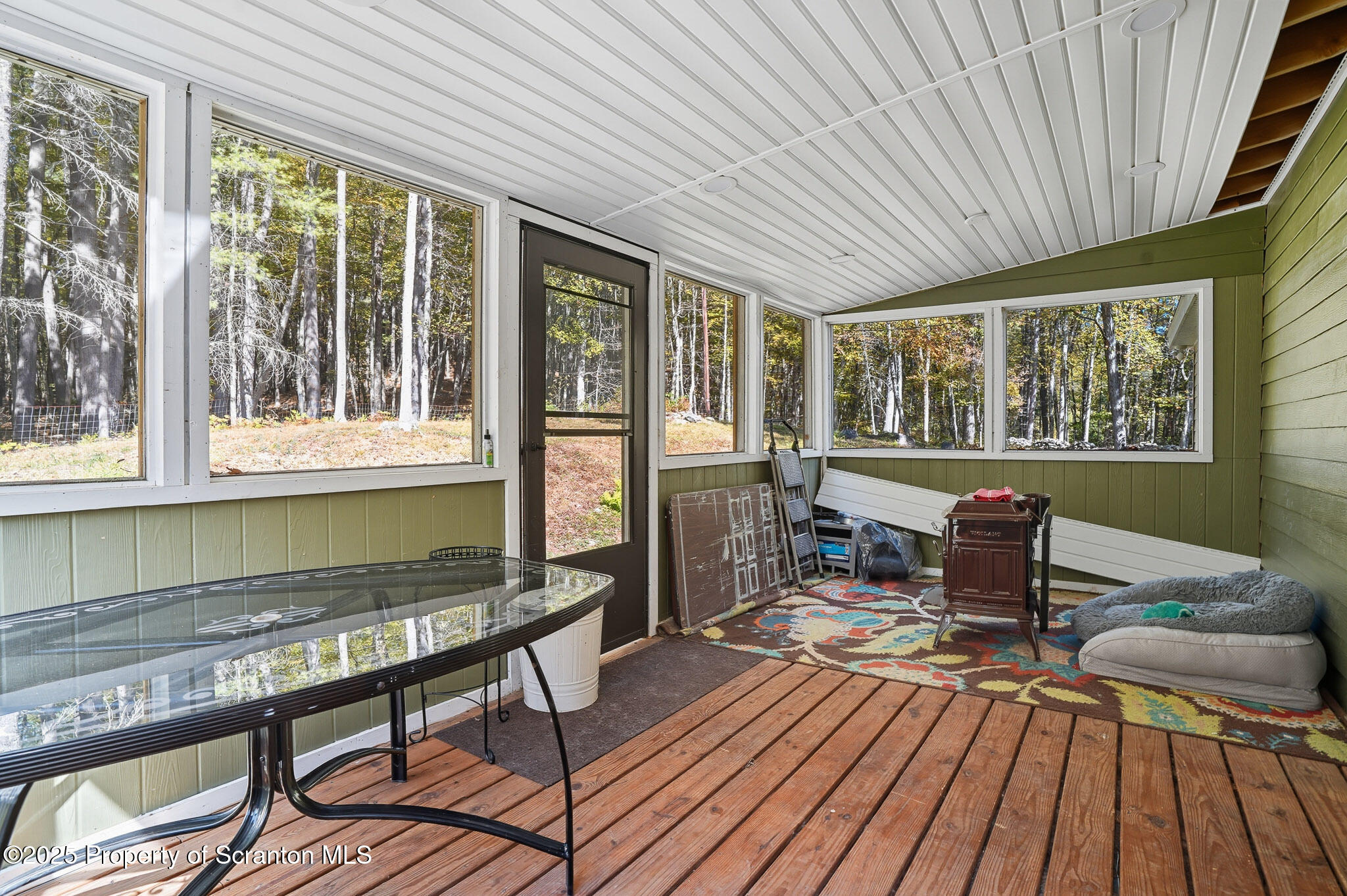452 Engvaldsen Road Hawley, PA 18428 - Photo 27 of 42 a living room with furniture a wooden floor and window