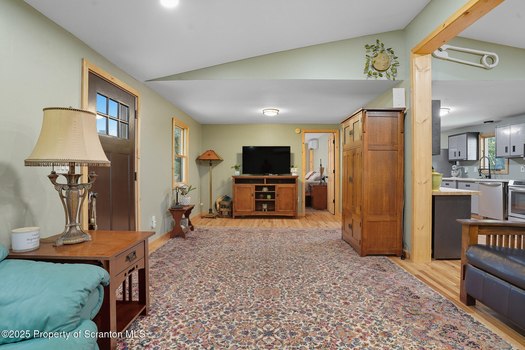 452 Engvaldsen Road Hawley, PA 18428 - Photo 6 of 42 a living room with furniture and a flat screen tv