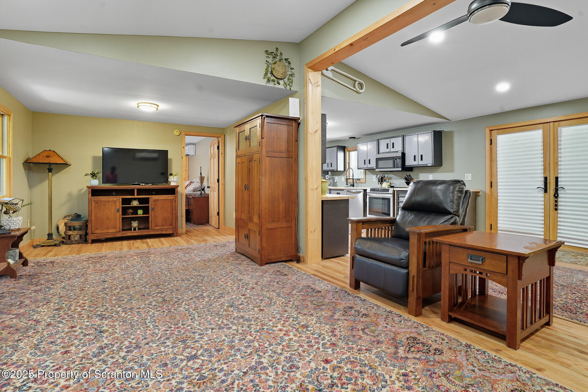 452 Engvaldsen Road Hawley, PA 18428 - Photo 7 of 42 a view of a livingroom with furniture and a flat screen tv
