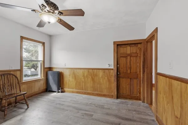 a view of livingroom with hardwood floor and ceiling fan