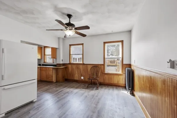 a view of room with window and wooden floor