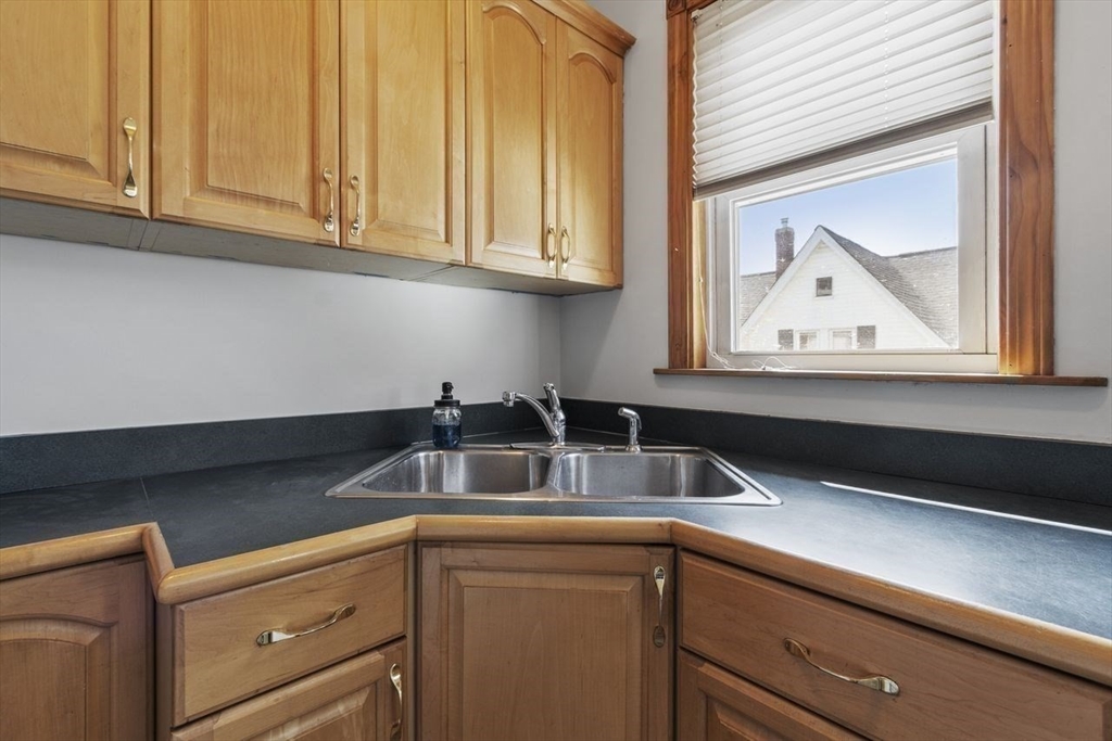 51 Marblehead Street, Unit 51 North Andover, MA 01845 - Photo 15 of 27 a kitchen with stainless steel appliances granite countertop a sink and a white cabinets