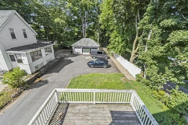 a view of house with yard and outdoor seating