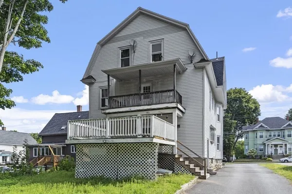 a view of front of house with a yard