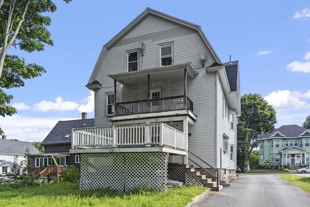 a view of front of house with a yard