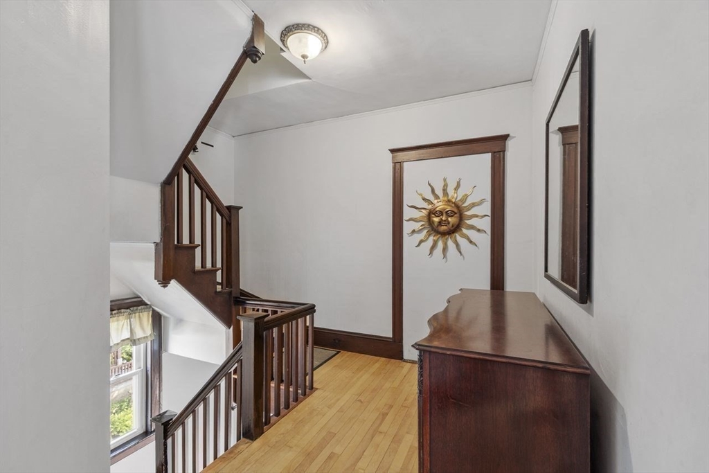 51 Marblehead Street, Unit 51 North Andover, MA 01845 - Photo 6 of 27 a view of hallway with stairs and wooden floor