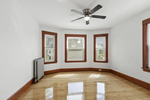 a view of livingroom with hardwood floor and ceiling fan