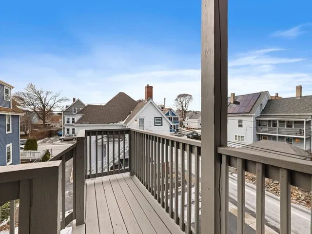 a view of a brick building from the balcony