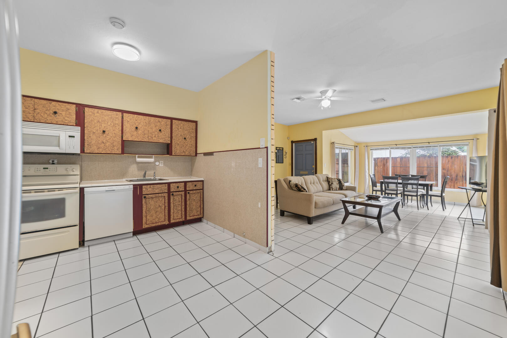 906 Northeast 5th Street Hallandale Beach, FL 33009 - Photo 11 of 35 a kitchen with a sink a stove and cabinets