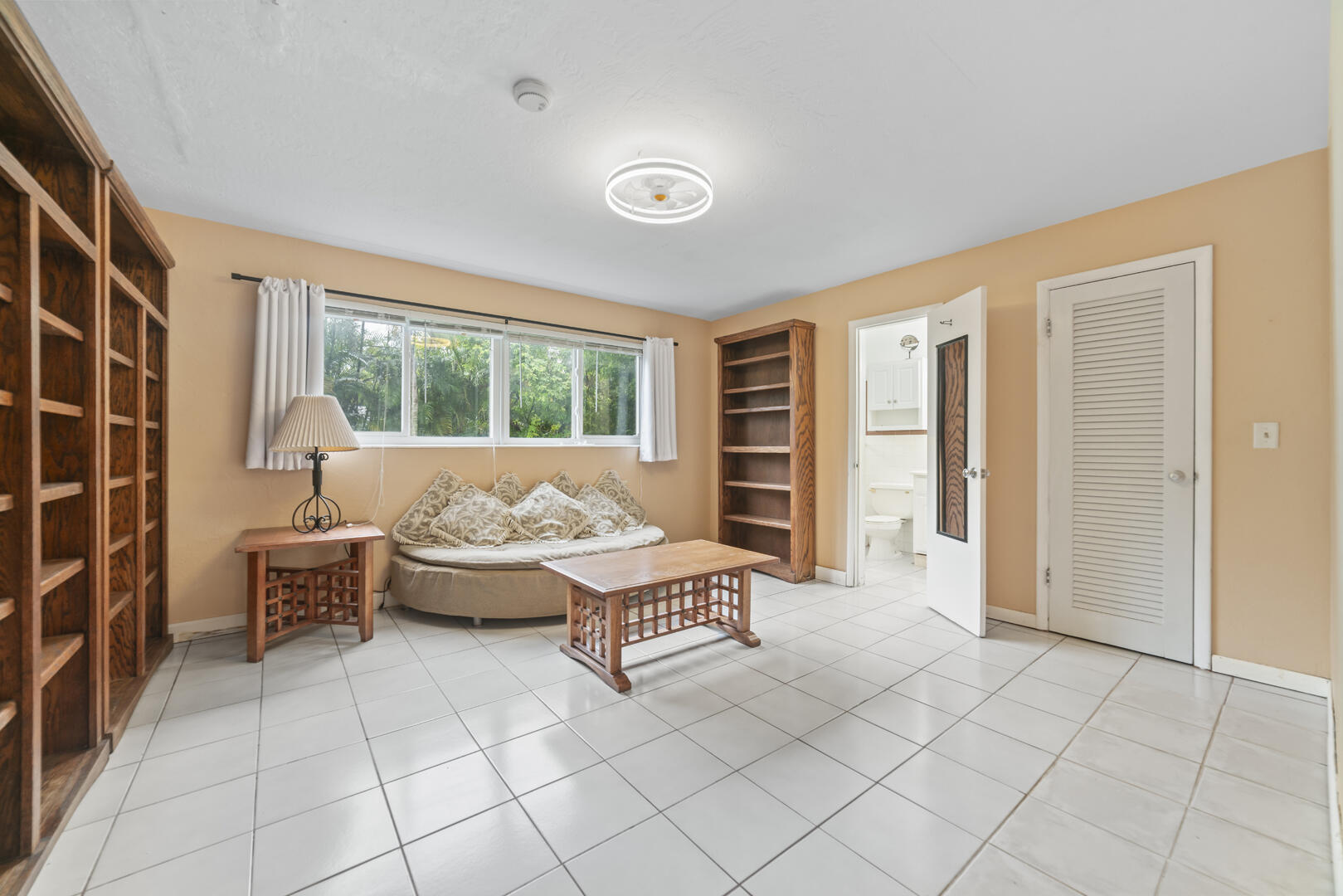 906 Northeast 5th Street Hallandale Beach, FL 33009 - Photo 12 of 35 a living room with furniture and large windows