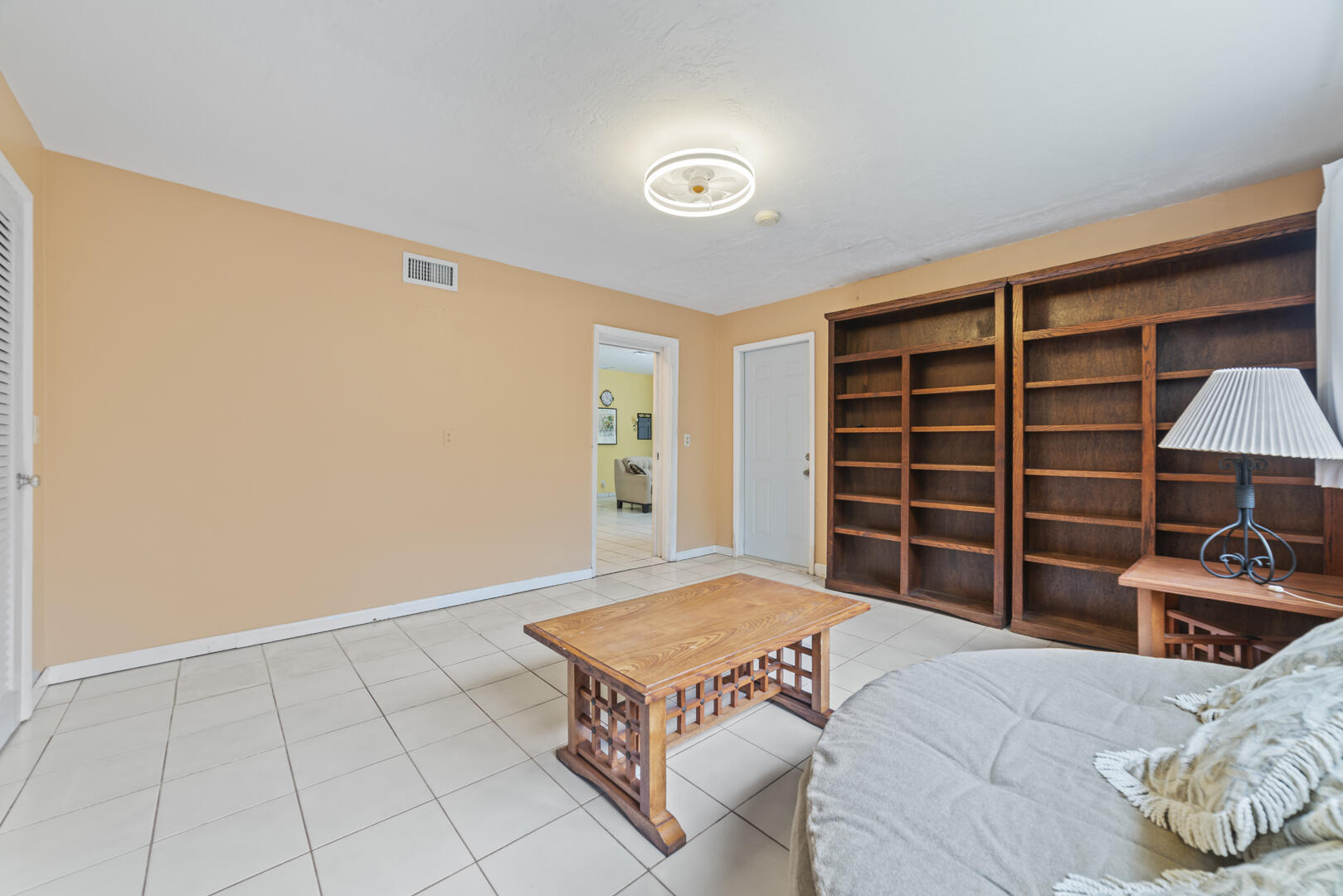 906 Northeast 5th Street Hallandale Beach, FL 33009 - Photo 13 of 35 a living room with a bed and furniture