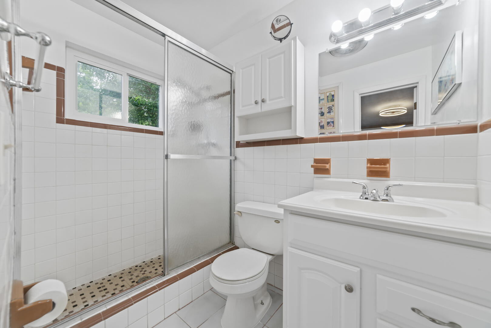 906 Northeast 5th Street Hallandale Beach, FL 33009 - Photo 14 of 35 a bathroom with a sink toilet and shower