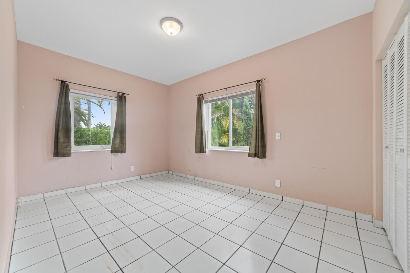 906 Northeast 5th Street Hallandale Beach, FL 33009 - Photo 15 of 35 an empty room with windows