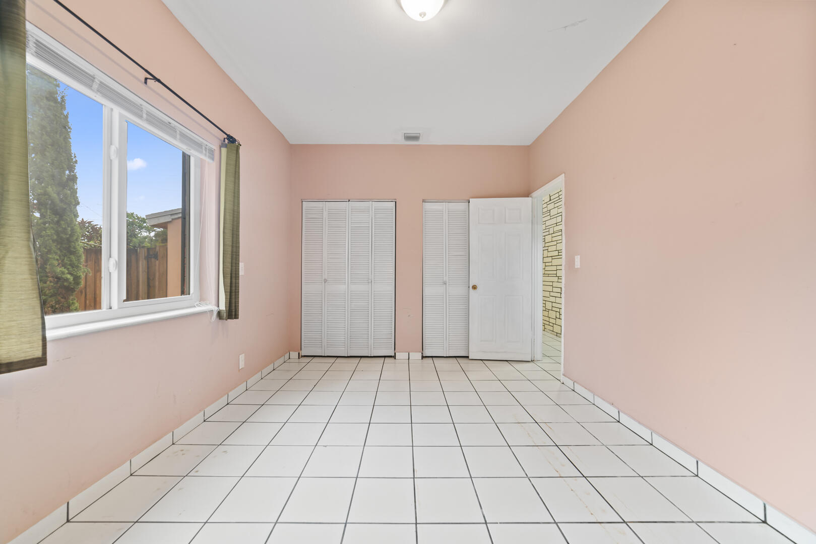 906 Northeast 5th Street Hallandale Beach, FL 33009 - Photo 16 of 35 a view of an empty room and window