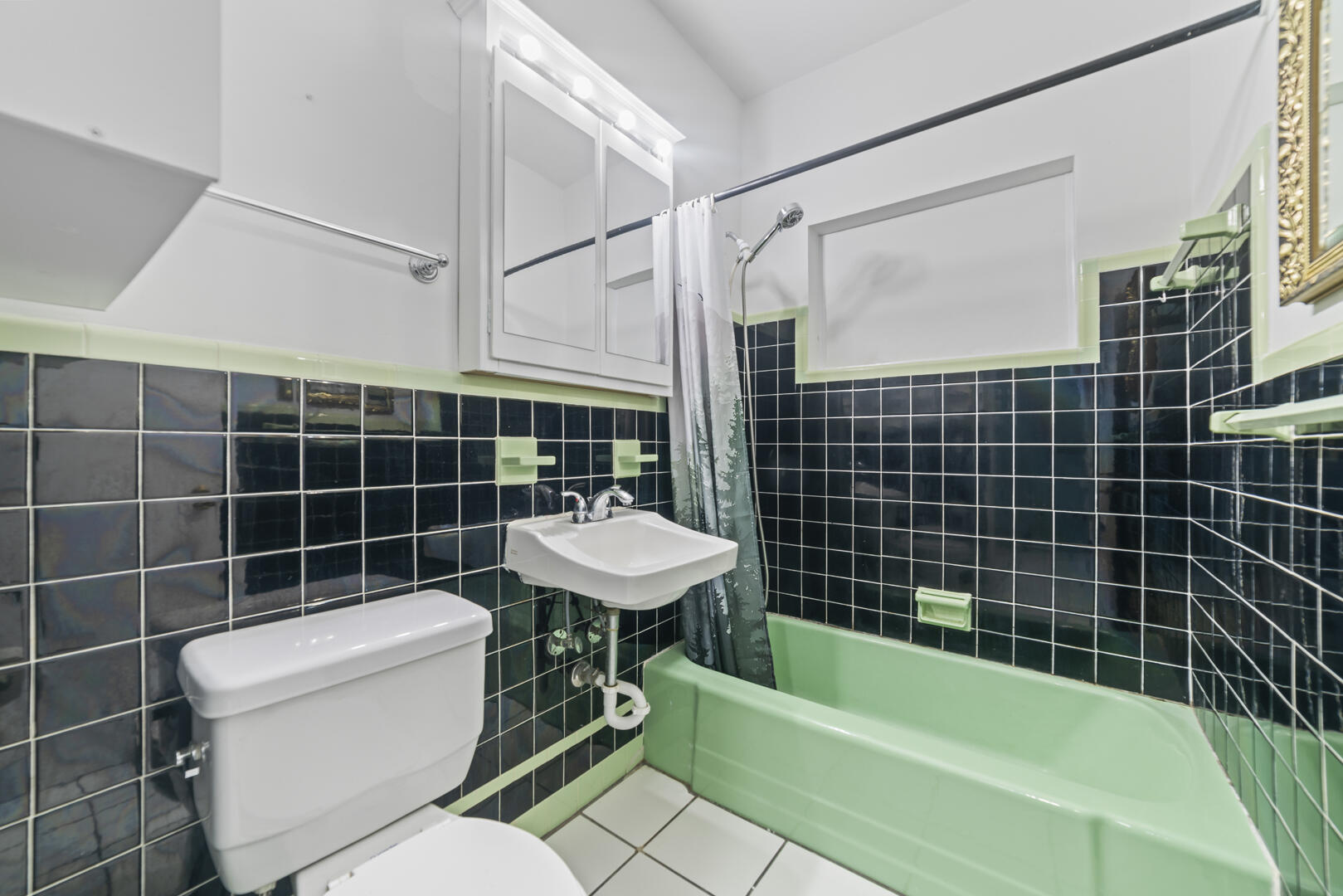 906 Northeast 5th Street Hallandale Beach, FL 33009 - Photo 17 of 35 a bathroom with a sink toilet and shower