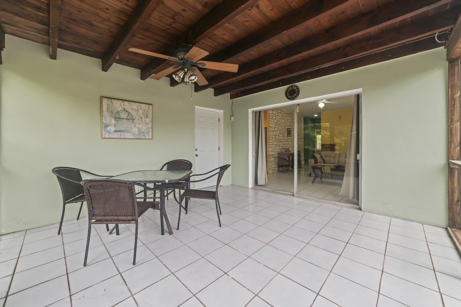 906 Northeast 5th Street Hallandale Beach, FL 33009 - Photo 20 of 35 a dining room with furniture and a chandelier