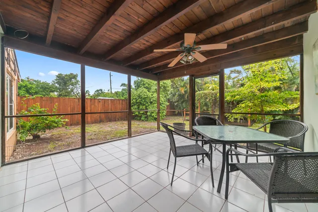 a view of a patio with a table chairs and a table