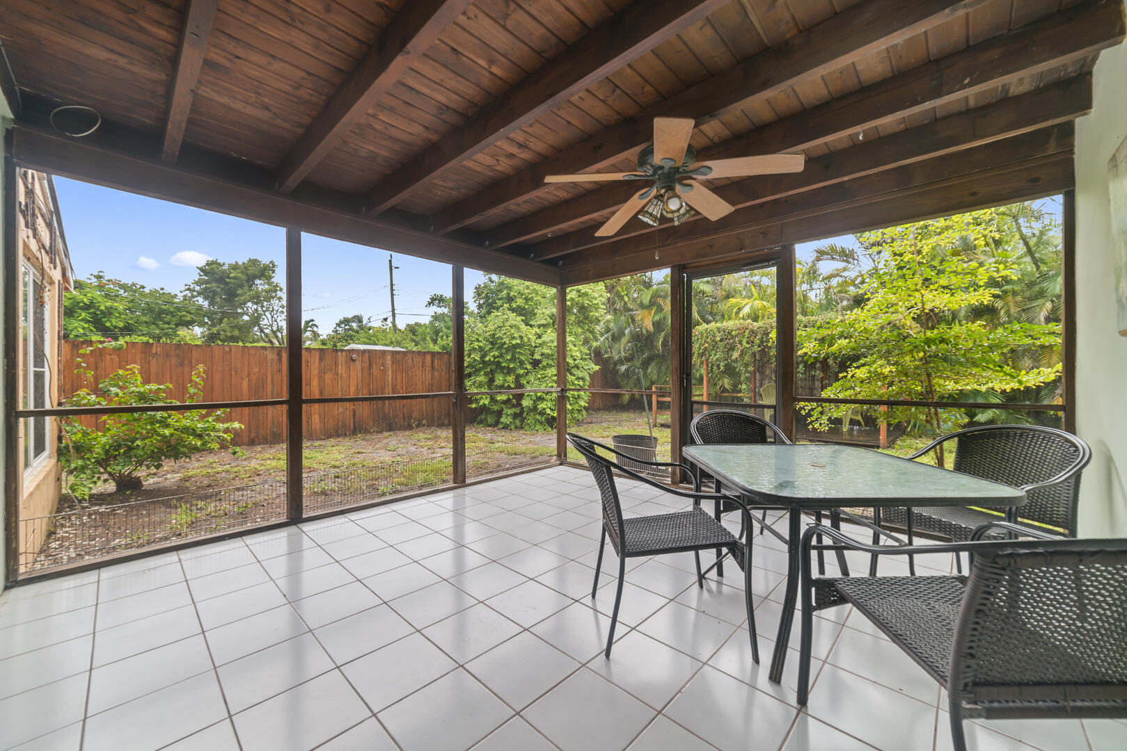 906 Northeast 5th Street Hallandale Beach, FL 33009 - Photo 21 of 35 a view of a patio with a table chairs and a table