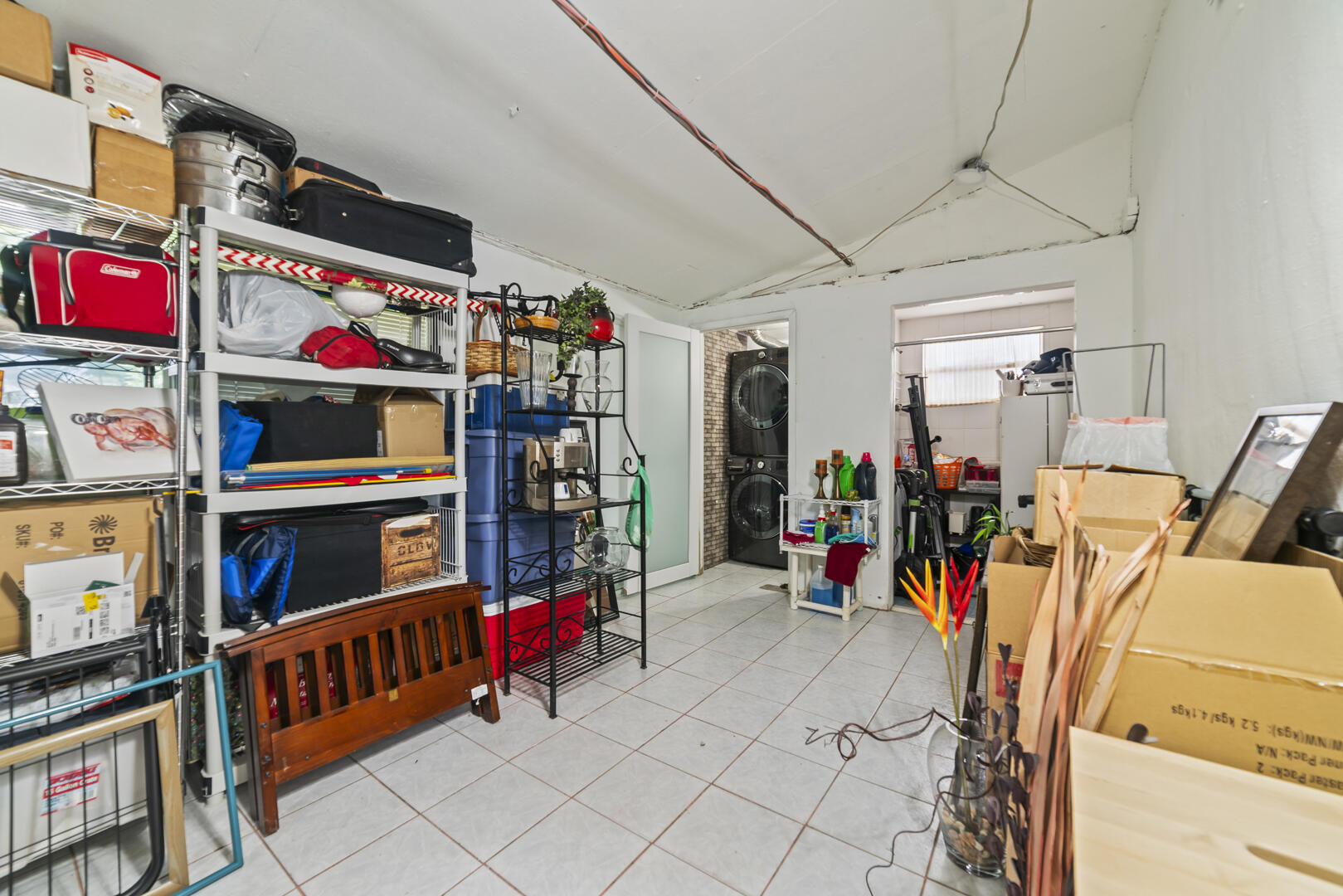 906 Northeast 5th Street Hallandale Beach, FL 33009 - Photo 23 of 35 a view of a garage with rack and bicycle