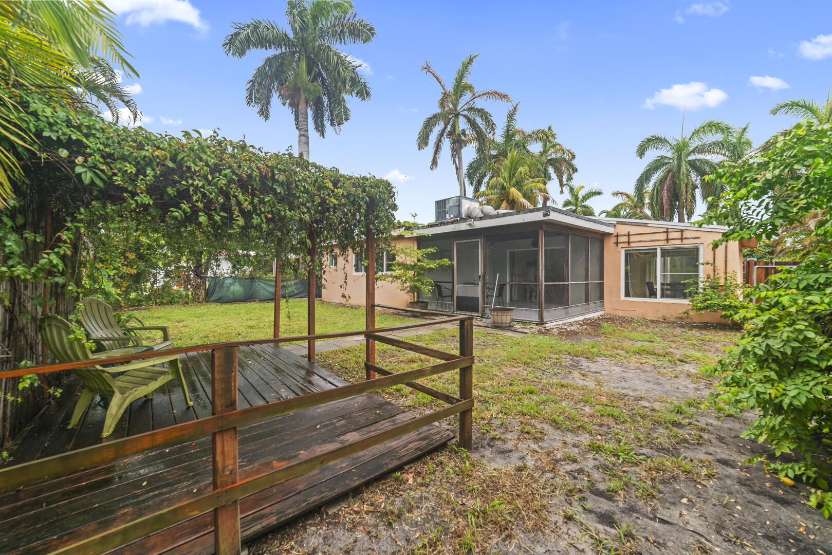 906 Northeast 5th Street Hallandale Beach, FL 33009 - Photo 26 of 35 a view of a house with swimming pool