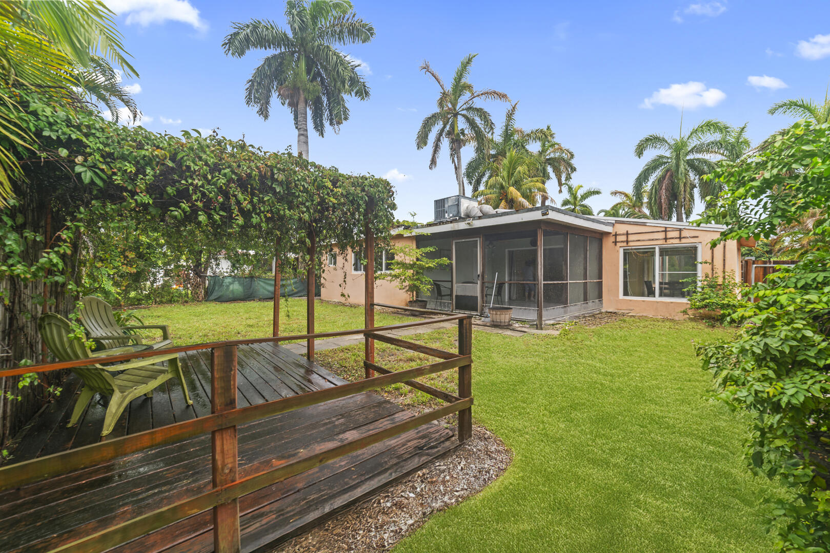 906 Northeast 5th Street Hallandale Beach, FL 33009 - Photo 27 of 35 a view of a house with pool and sitting area