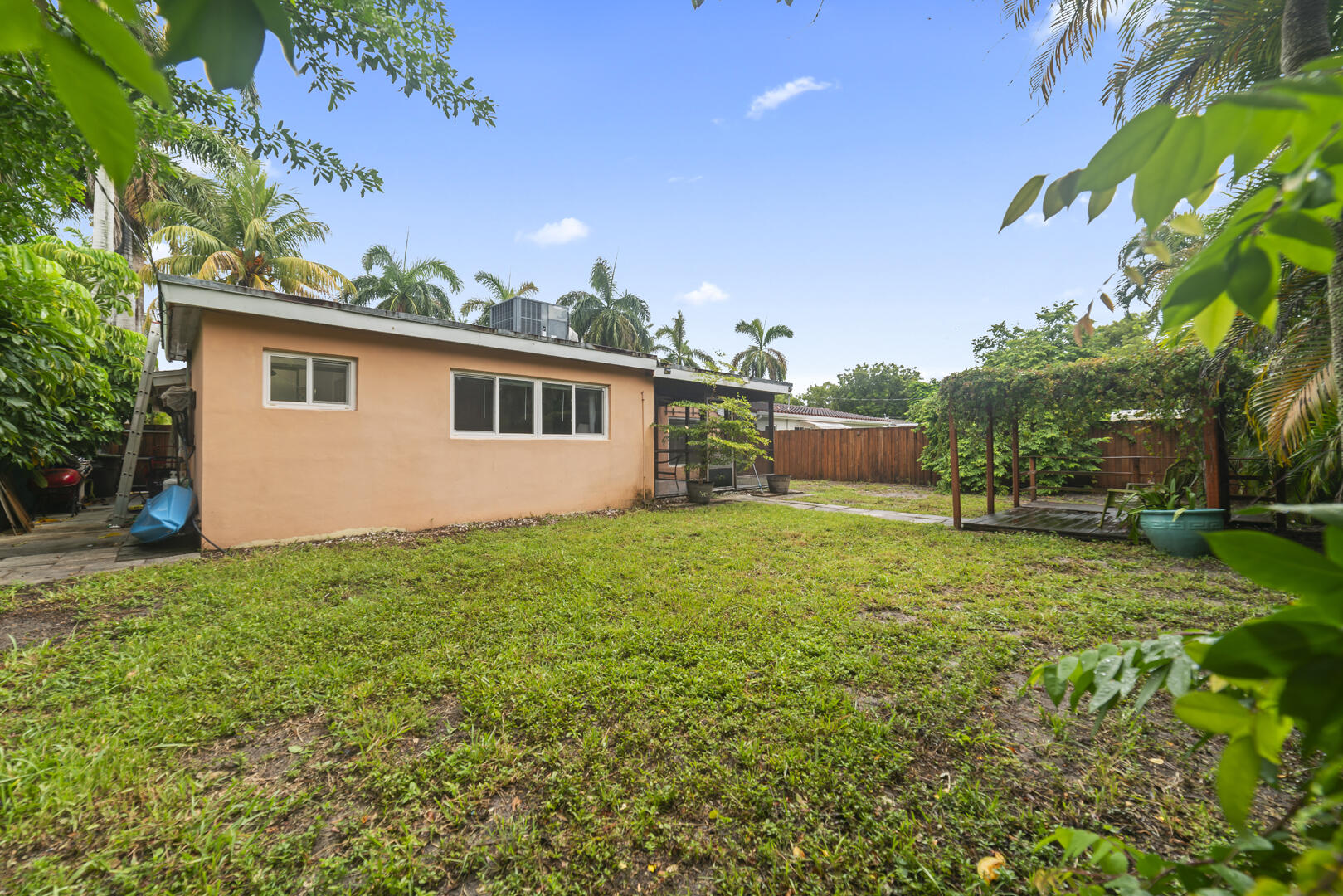 906 Northeast 5th Street Hallandale Beach, FL 33009 - Photo 28 of 35 a front view of house with yard and trees