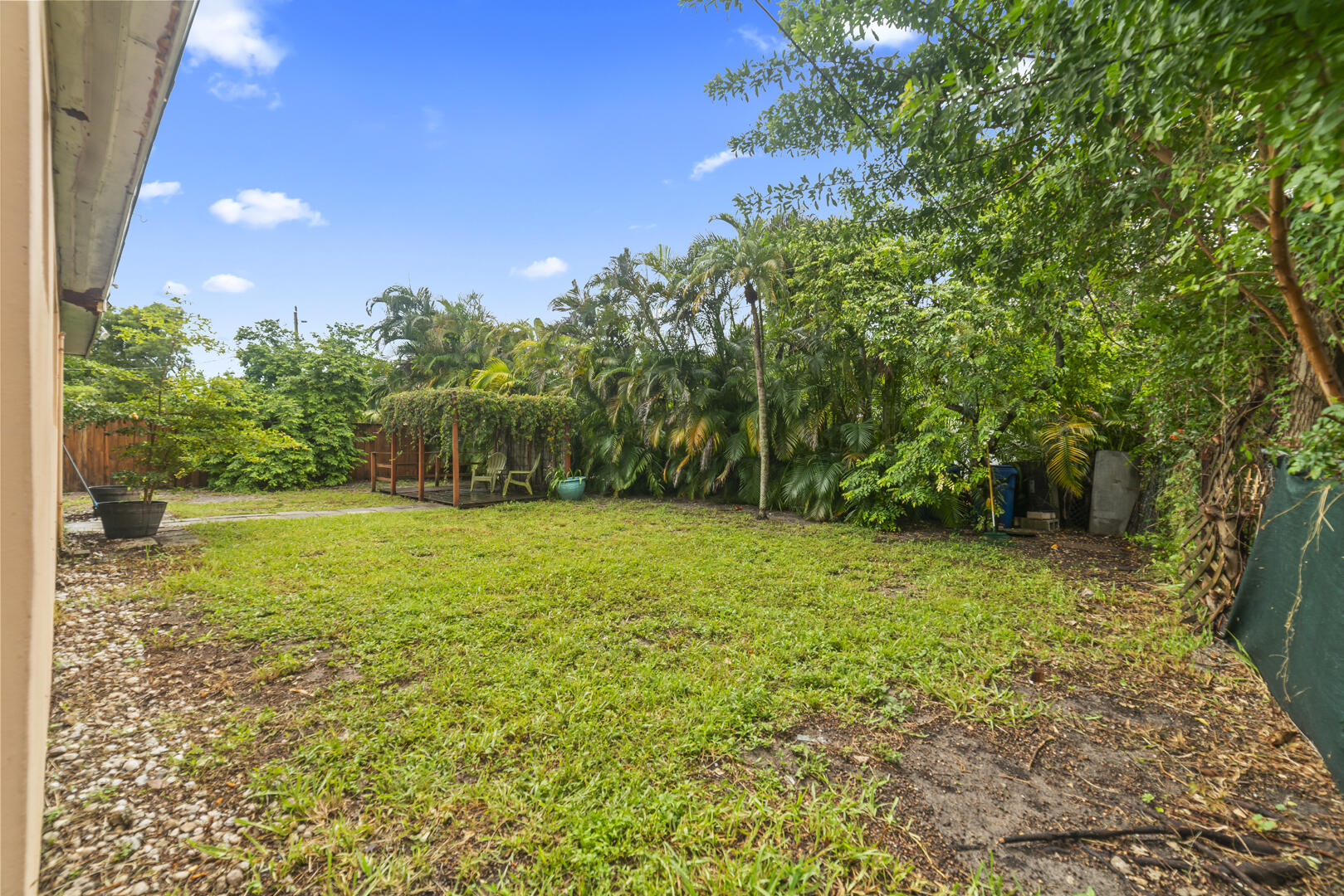 906 Northeast 5th Street Hallandale Beach, FL 33009 - Photo 32 of 35 a view of a yard with a house