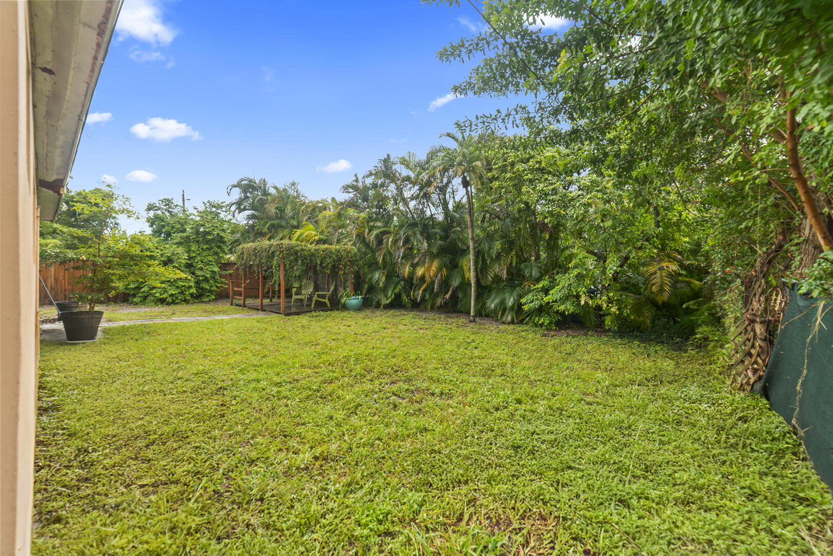 906 Northeast 5th Street Hallandale Beach, FL 33009 - Photo 33 of 35 a view of a yard with a house