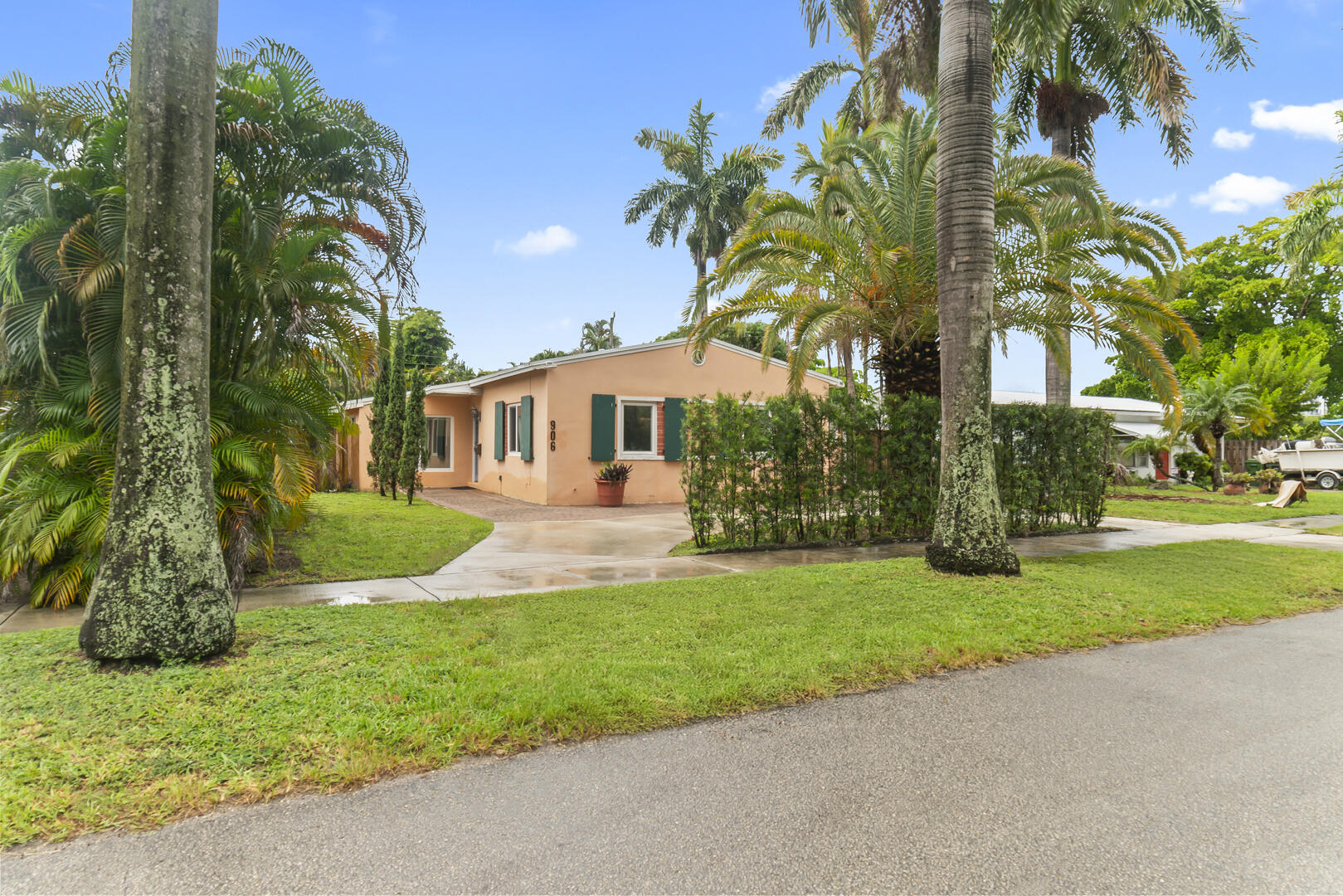 906 Northeast 5th Street Hallandale Beach, FL 33009 - Photo 35 of 35 a front view of a house with a yard and porch