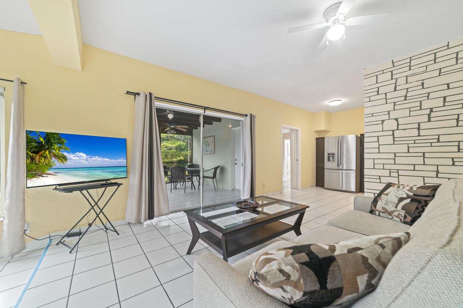 906 Northeast 5th Street Hallandale Beach, FL 33009 - Photo 6 of 35 a living room with furniture and a flat screen tv