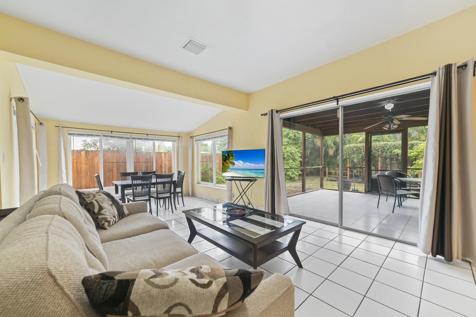 906 Northeast 5th Street Hallandale Beach, FL 33009 - Photo 7 of 35 a living room with furniture and a flat screen tv