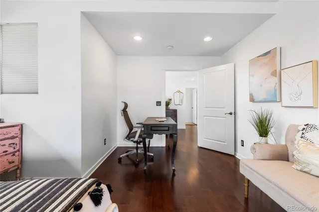 a work room with furniture and wooden floor