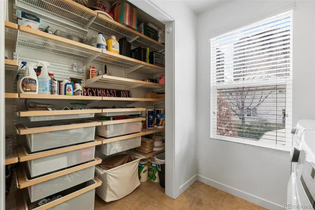 a view of storage and utility room with racks on the wall