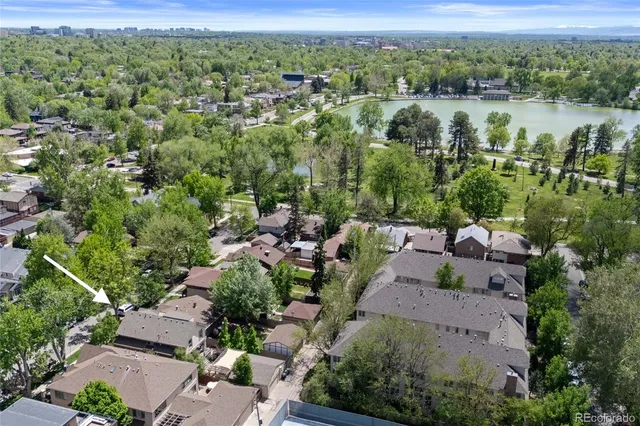 an aerial view of a house with a yard