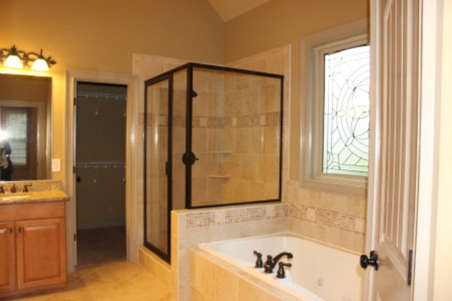 154 Rivers Edge Drive Forsyth, GA 31029 - Photo 14 of 17 a bathroom with a shower and a bathtub