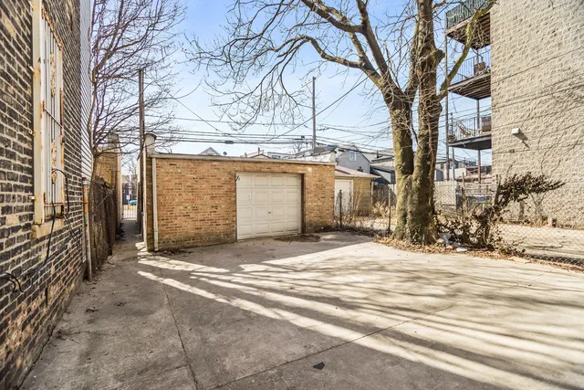 a view of a house with a snow in the road