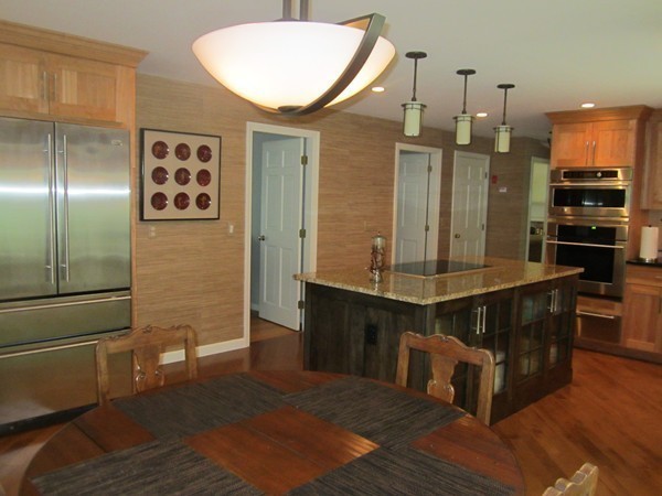 286 Sargent Road Boxborough, MA 01719 - Photo 13 of 29 a kitchen with stainless steel appliances granite countertop a refrigerator a stove and a sink