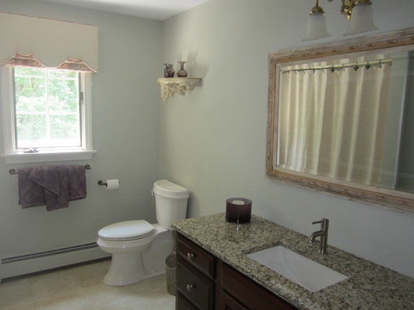 286 Sargent Road Boxborough, MA 01719 - Photo 23 of 29 a bathroom with a granite countertop sink and a toilet