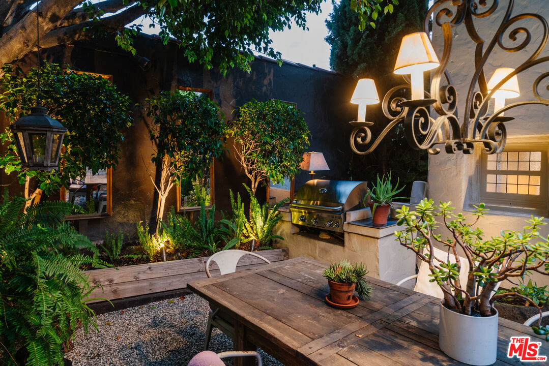 8430 Cresthill Road Los Angeles, CA 90069 - Photo 11 of 36 a view of a house with patio