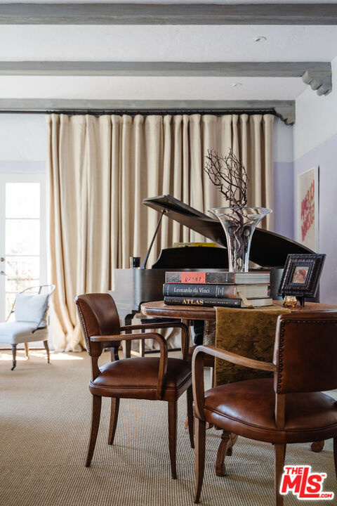 8430 Cresthill Road Los Angeles, CA 90069 - Photo 13 of 36 a workspace with furniture and rug