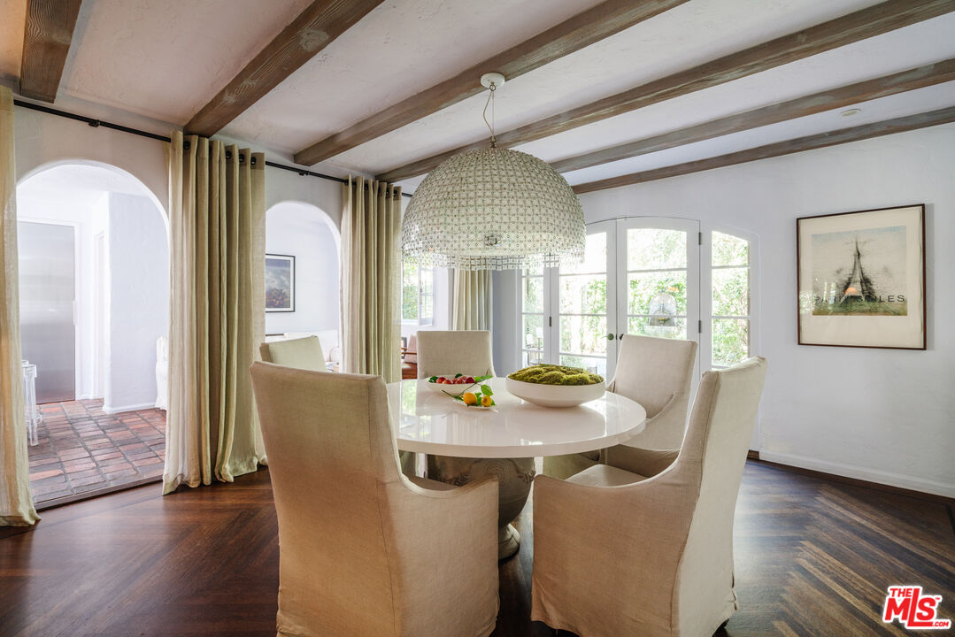 8430 Cresthill Road Los Angeles, CA 90069 - Photo 15 of 36 a view of a dining room with furniture window and wooden floor