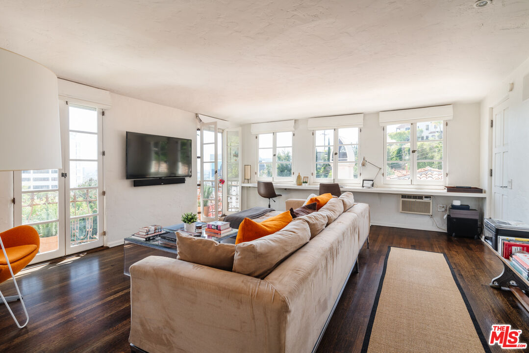 8430 Cresthill Road Los Angeles, CA 90069 - Photo 22 of 36 a living room with furniture and a flat screen tv