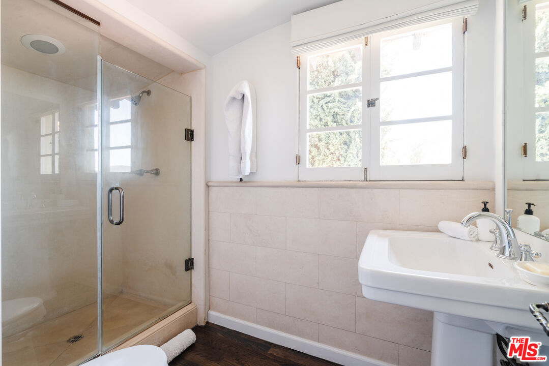 8430 Cresthill Road Los Angeles, CA 90069 - Photo 29 of 36 a bathroom with a shower and a sink