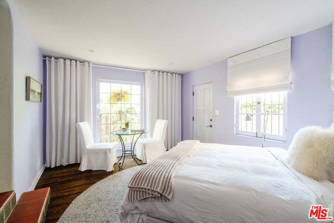 8430 Cresthill Road Los Angeles, CA 90069 - Photo 30 of 36 a bedroom with a bed and a window