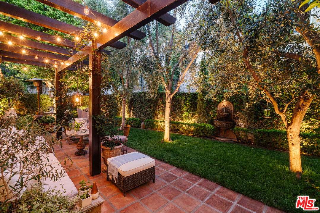 8430 Cresthill Road Los Angeles, CA 90069 - Photo 33 of 36 a view of a backyard with sitting area