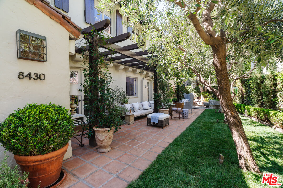 8430 Cresthill Road Los Angeles, CA 90069 - Photo 4 of 36 a view of a backyard with sitting area and garden