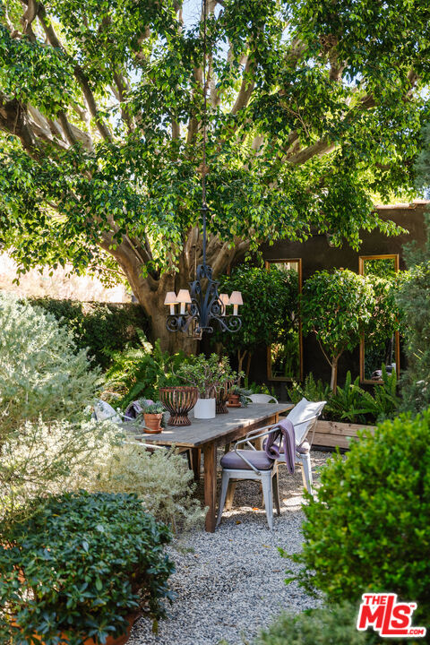 8430 Cresthill Road Los Angeles, CA 90069 - Photo 6 of 36 a view of a bench in a garden