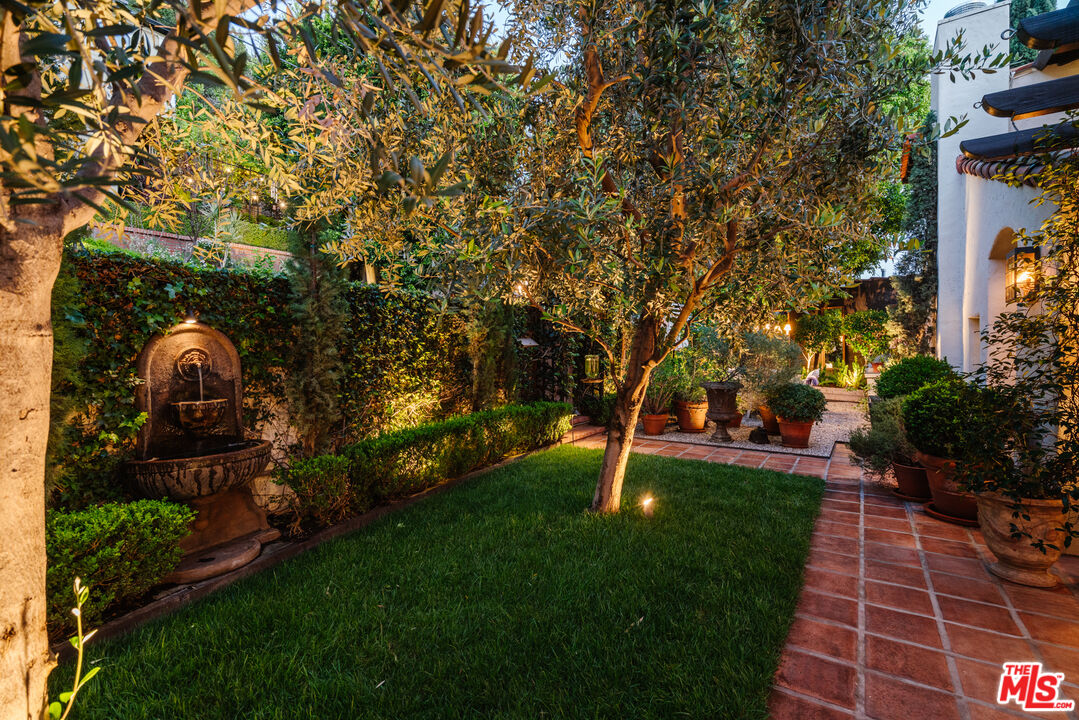 8430 Cresthill Road Los Angeles, CA 90069 - Photo 8 of 36 a view of a garden