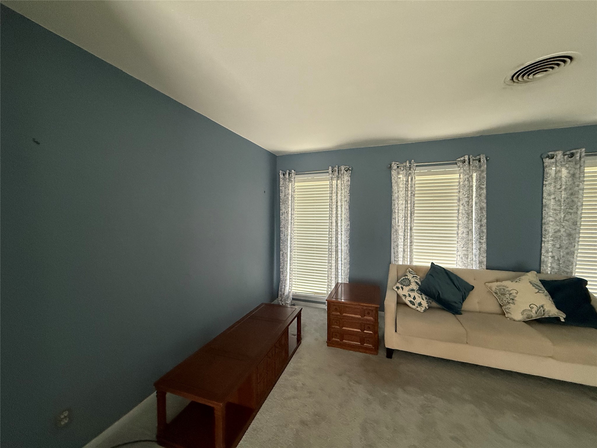 7945 Cedel Drive Houston, TX 77055 - Photo 2 of 11 a living room with furniture and a window
